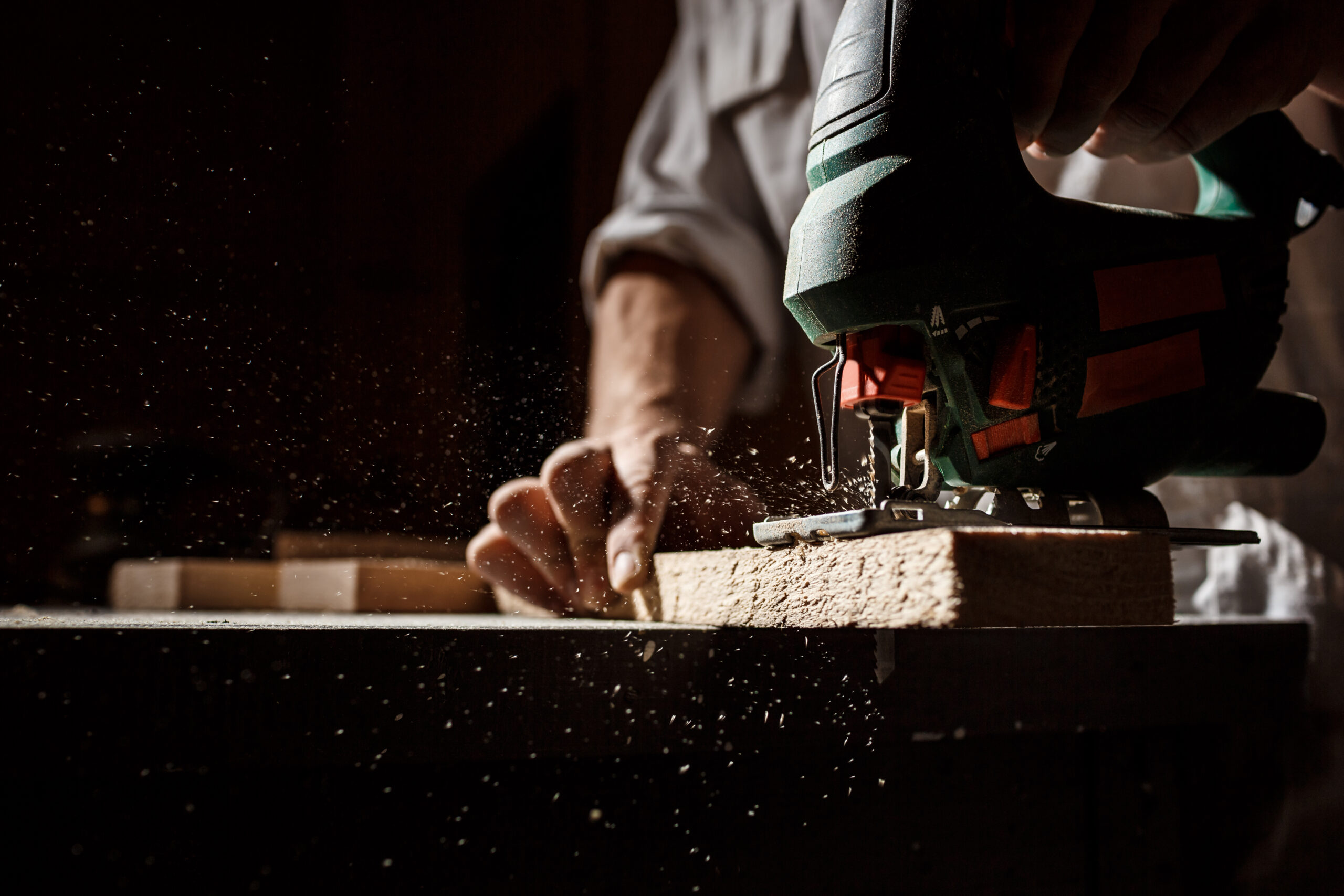 Close up photo of cutting wood with fretsaw