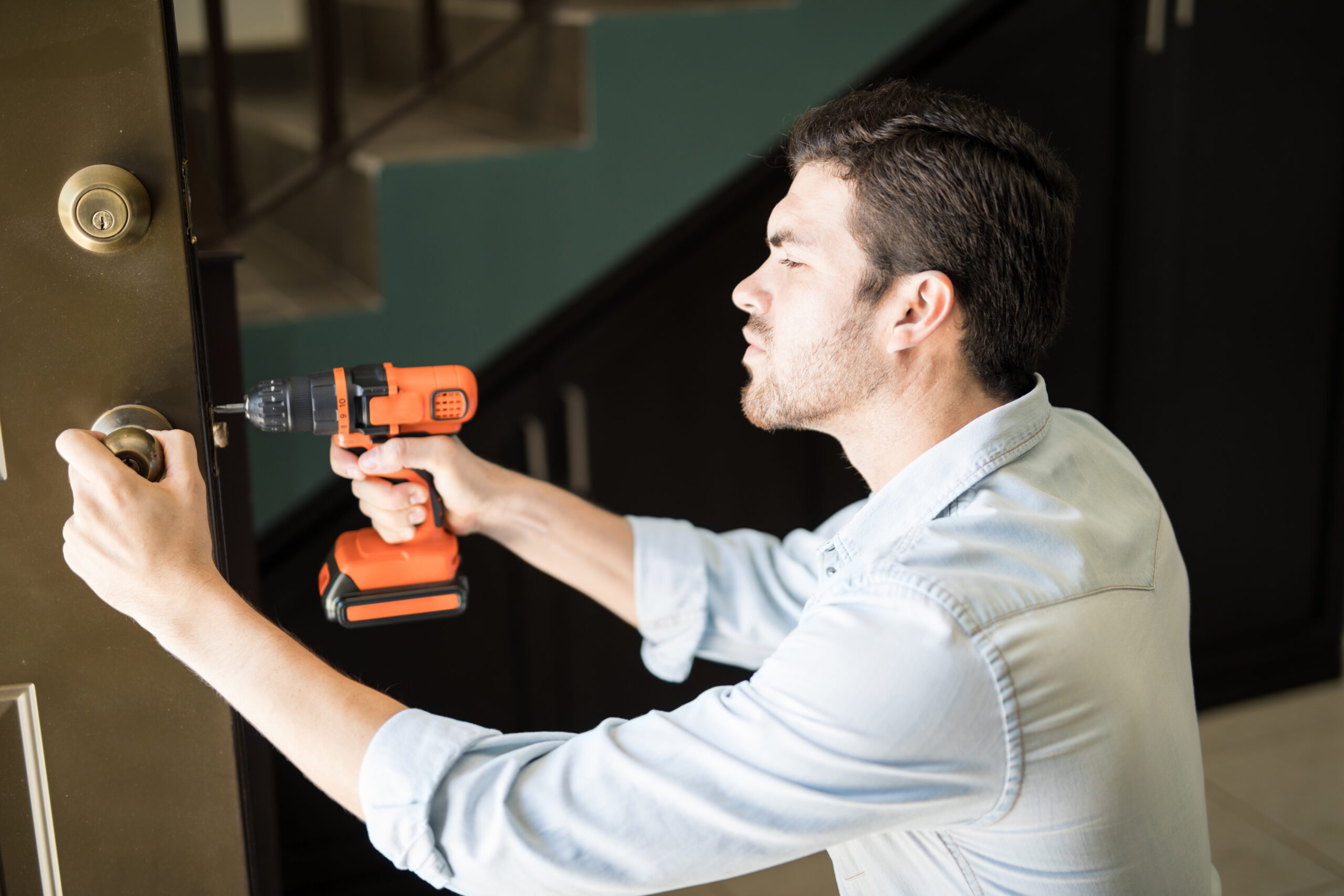 Handyman fixing a door knob